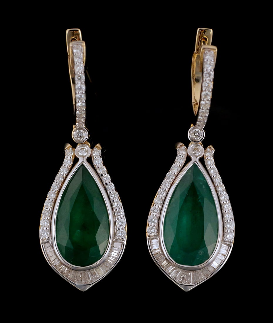 14K Emerald & Diamond Earrings: 14K two-tone gold earrings. Two pear brilliant faceted natural emerald beryl gemstones totaling 7.26 carats. Emerald dimensions 15.76 x 8.37 mm and 15.47 x 8.48 mm. Baguette and round brilliant cut na