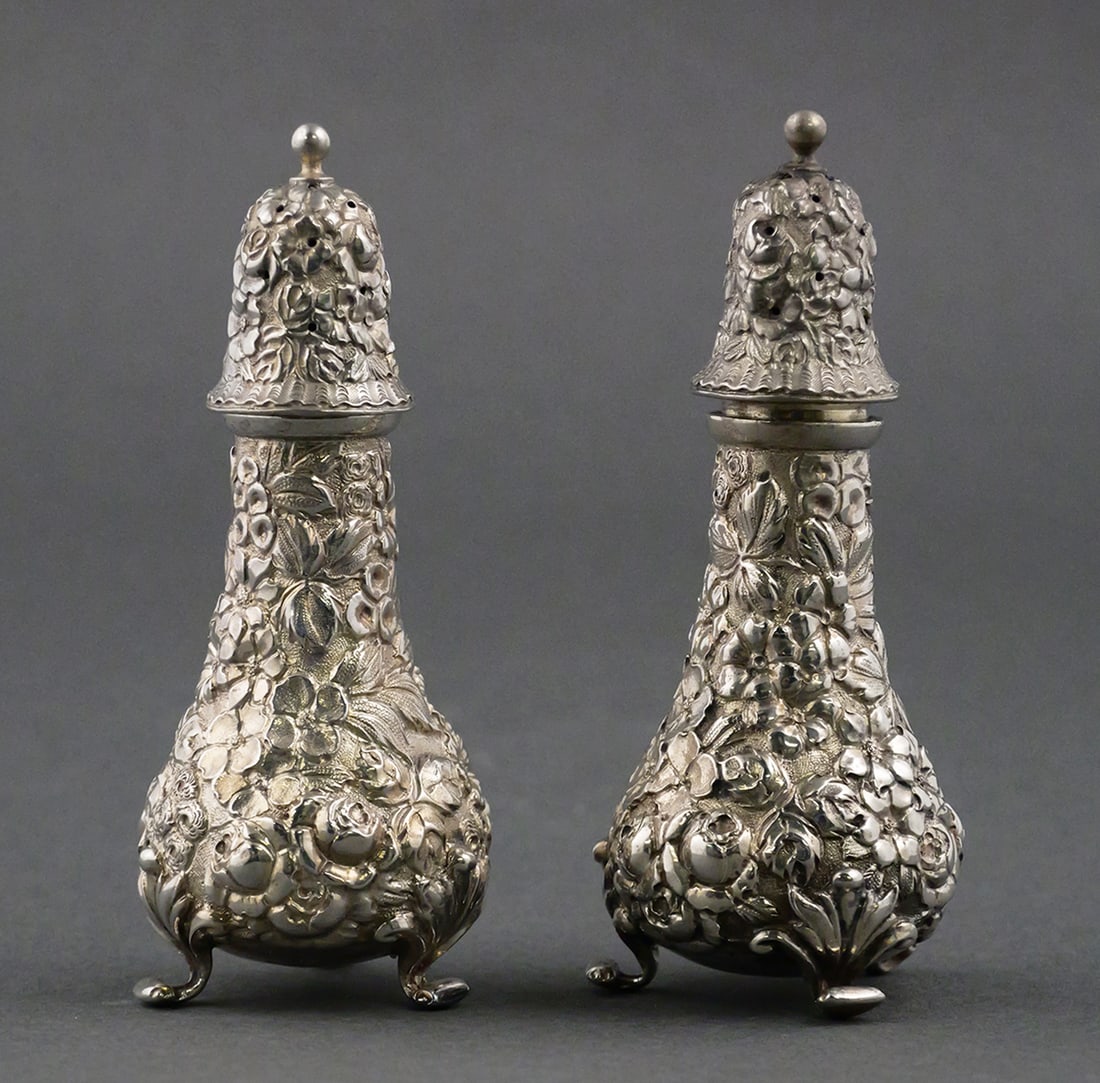 Baltimore Silver Co. Rose Repousse Shakers: Antique Baltimore Sterling Silver Co. unweighted 925 rose pattern "Baltimore Rose" repousse floral salt and pepper shakers. Marked Baltimore Sterling Co, which became Stieff in 1904. Sterling, 2.9 oz