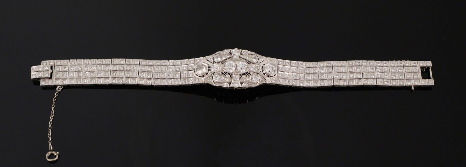 Art Deco Platinum Bracelet, 4.9 ctw Diamonds: Stunning vintage 1920s-30s platinum bracelet, 7" long, with four bead-set old European cut diamonds (2.04 ctw) surrounded by 12 bead-set transitional cut diamonds (.71 ctw) and 194 bead-set single