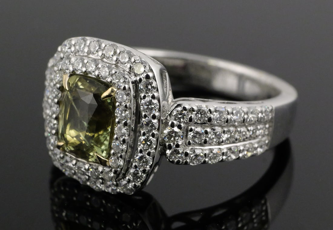 Platinum 18K Alexandrite & Diamond Ring: Platinum and 18K yellow gold ring. Size 6-3/4. Overall weight 6.7 grams. Center stone is a GIA-certified natural alexandrite chrysoberyl, cushion modified brilliant faceted cut, 1.30 carats,