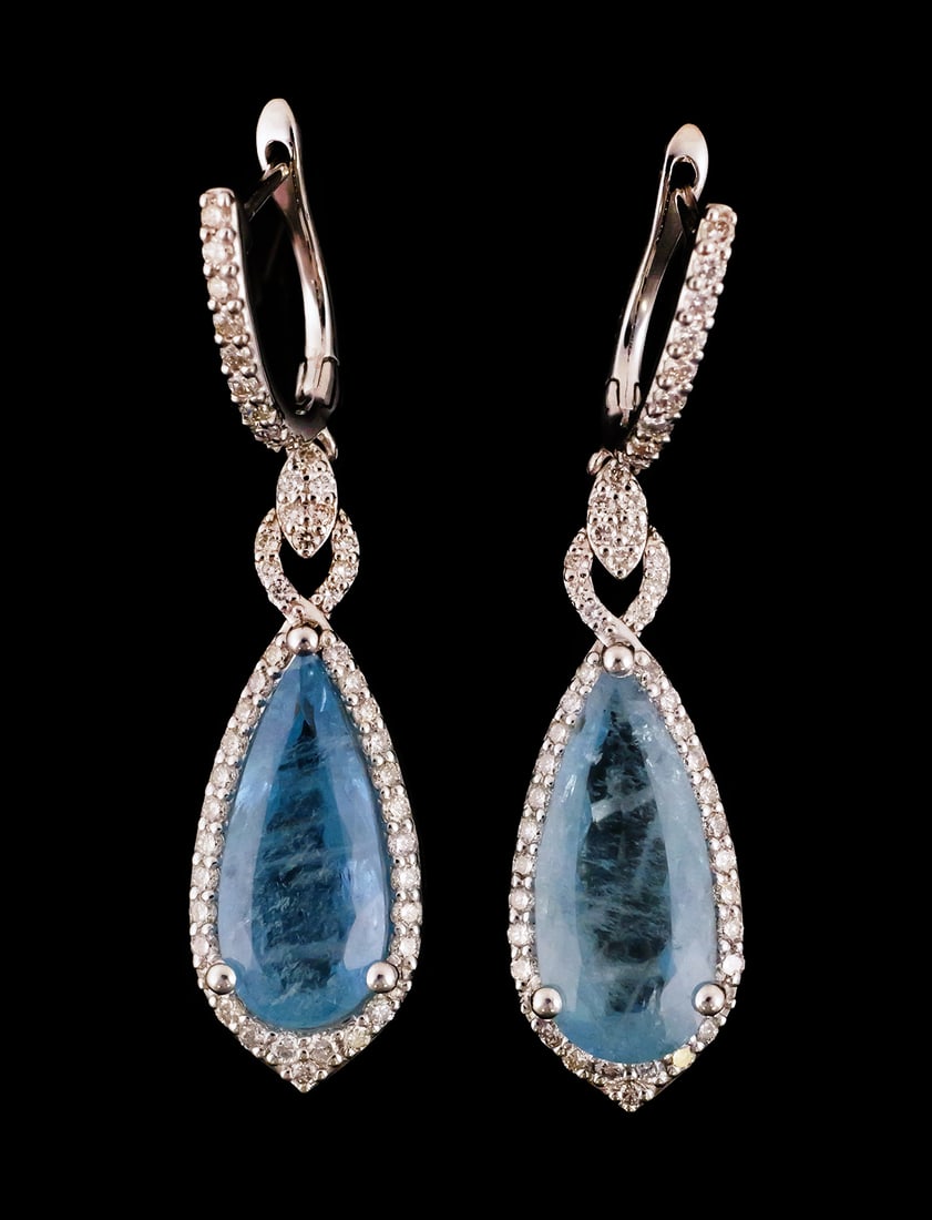 Platinum Aquamarine & Diamond Earrings: Platinum earrings. Two pear brilliant faceted natural aquamarine beryl gemstones totaling 6.10 carats. Aquamarine dimensions 16.82 x 7.51 mm and 16.32 x 7.04 mm. Color greenish blue. Transparency