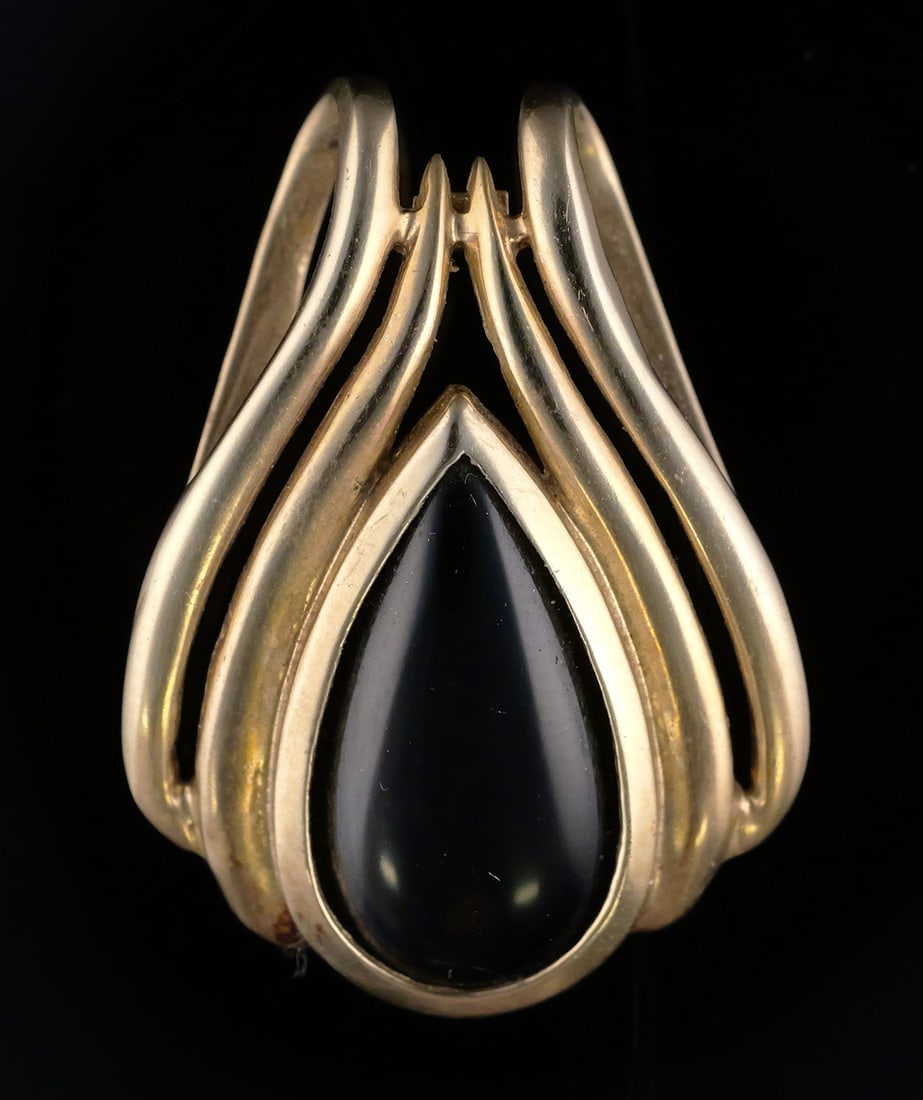10K Gold & Onyx Slide Pendant: 10 karat yellow gold set with a teardrop shape black onyx. Modernist contemporary design pendant or slide. 10 k yg, 6.91 grams tw. Approix. 1" wide, 1-3/8" long. This item can be shipped in-house.