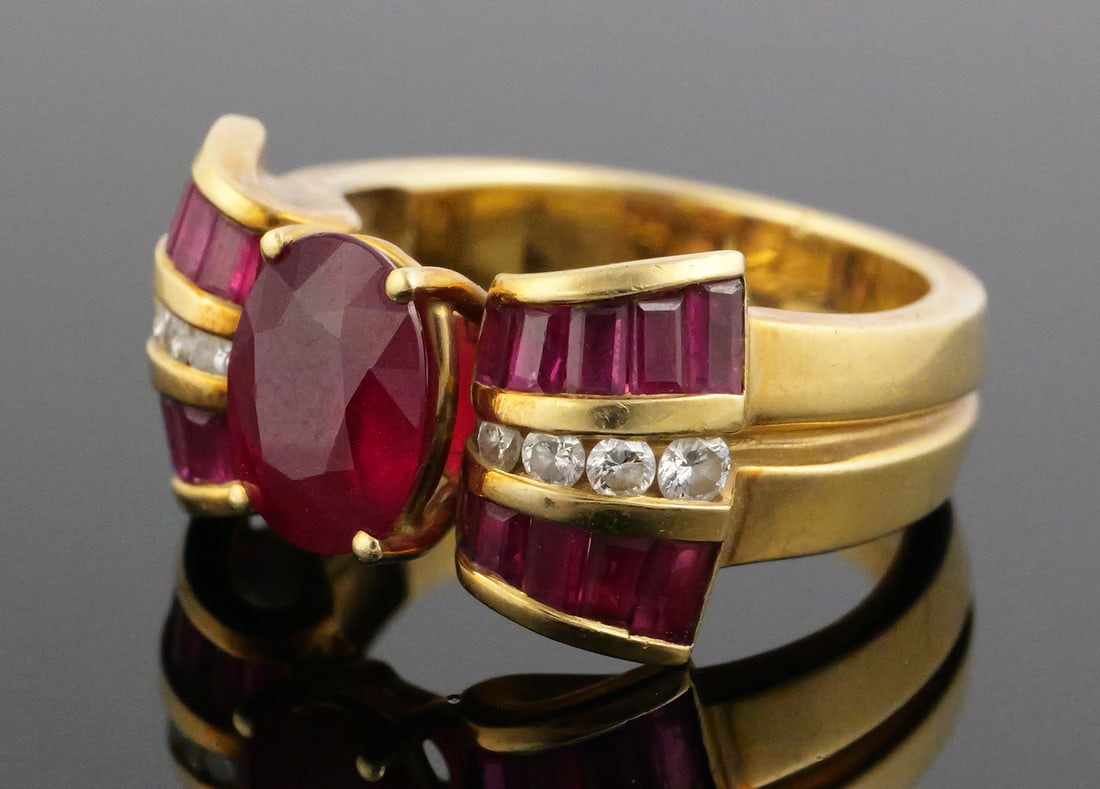 Charles KRYPELL 18k Gold Ruby Ring: Vintage 1980s Krypell 18k yellow gold ring with oval ruby flanked by round diamonds and ruby baguettes. Center ruby about 9x7mm (about 2.35 carats). Size 7. Total weight 11.9 grams. This item can be