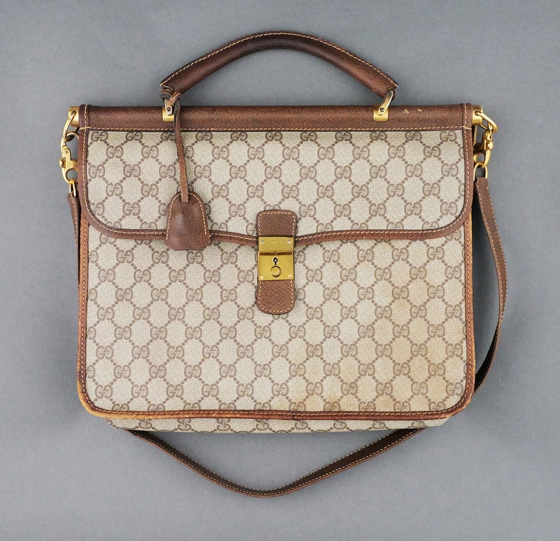GUCCI GG Supreme Hand Bag 2 Way COA: GUCCI GG Supreme Handbag PVC 2 way. Beige and gold. COA. Serial No. 24.02.2126. Measures approx. 13-1/4" x 10-1/2". This item can be shipped in-house. Multiple lot combined shipping may require 3rd