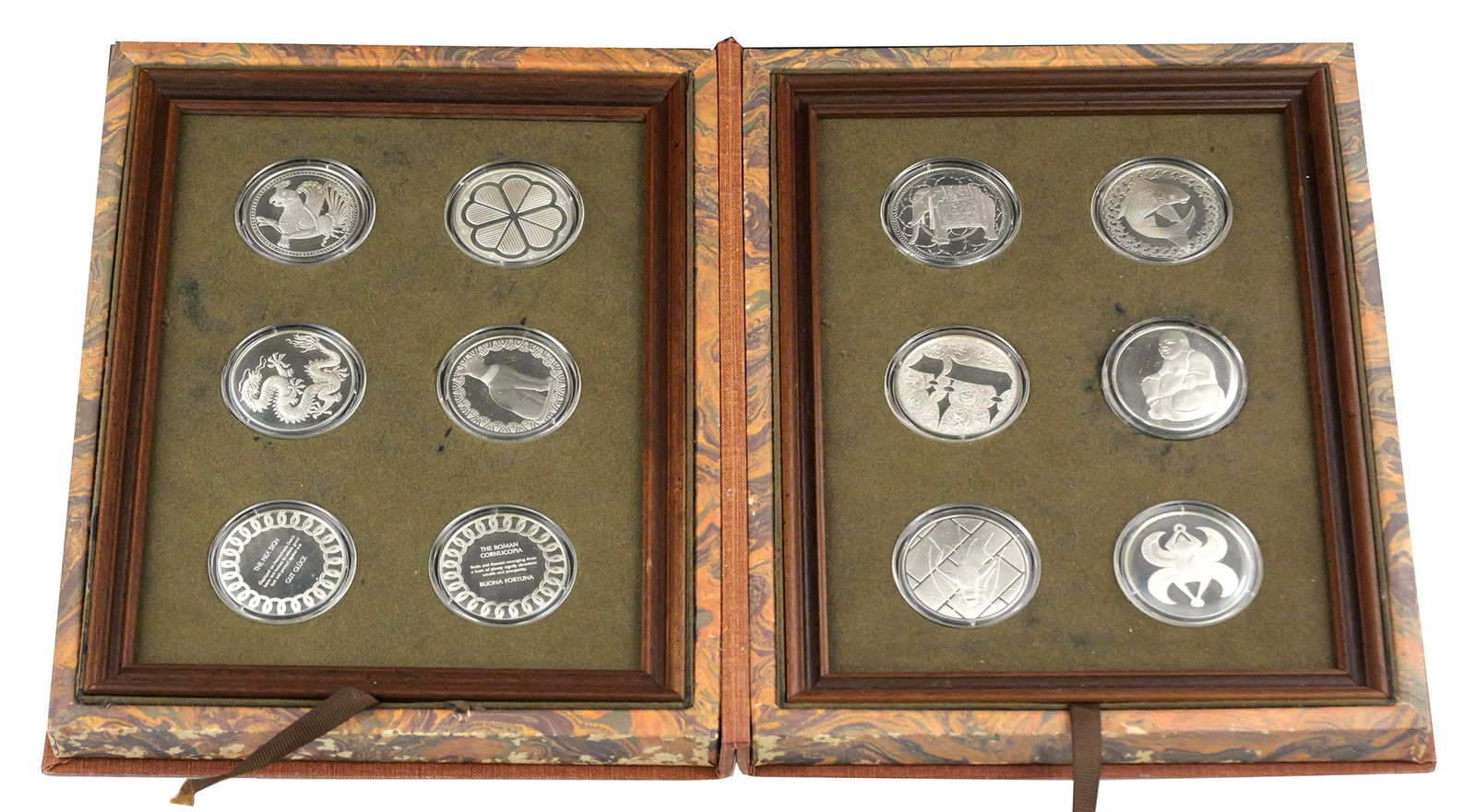 Sterling Good Luck Medals Franklin Mint: Franklin Mint Good Luck Medal Collection limited edition proof set with 12 medals in a book style display holder, 1977. This item can be shipped in-house. Multiple lot combined shipping may require