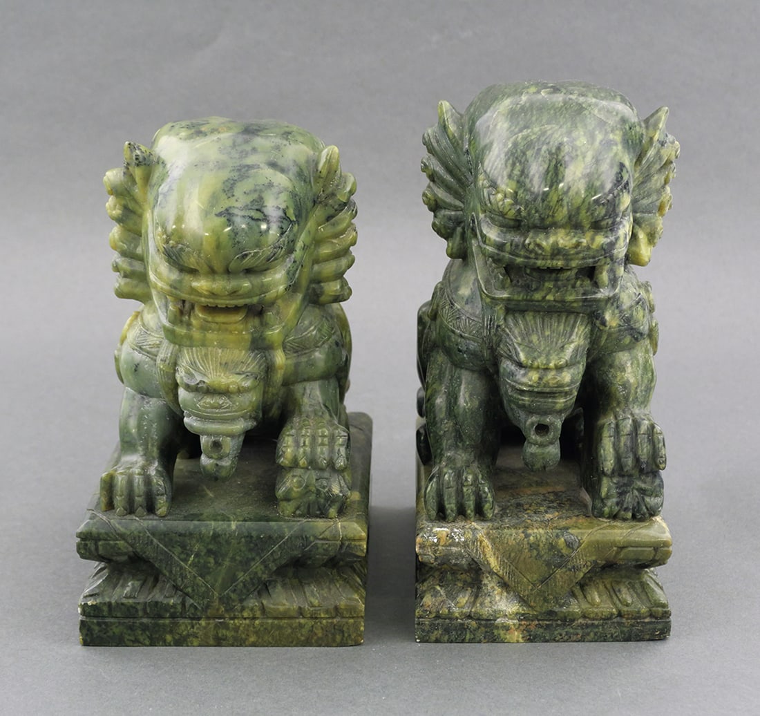Pair of Jade Carved Chinese Foo Dogs: Pair of variegated jade hardstone carved Chinese fu dogs or lions. Measure approximately 8-1/2" x 5-1/2" x 4". This item can be shipped in-house. Multiple lot combined shipping may require 3rd Party s