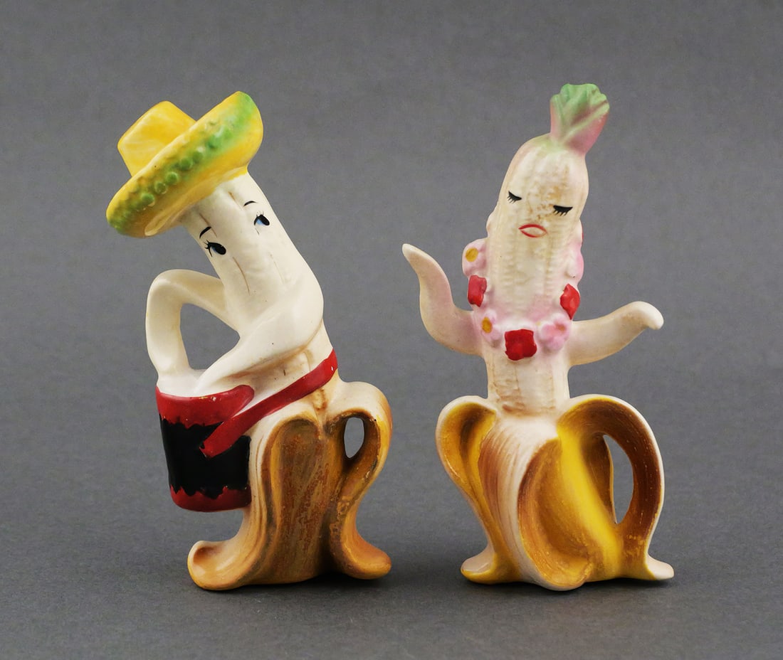 Enesco Banana People Salt & Pepper Shakers: Pair of vintage mid century anthropomorphic banana people Calypso drum player and dancer, ceramic novelty shakers. Enesco original foil label under drum. Dancer 4-1/2"H. This item can be shipped