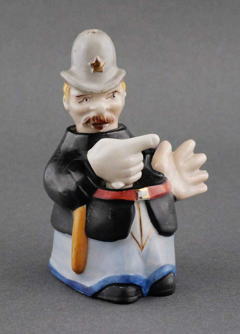 Policeman Nodder Shakers Pat T.T.: Vintage early or mid century nodder salt and pepper set in the form of a bobby constable, Keystone Cop type character. Three pieces, head and one hand rock, both marked in mold Pat. T.T., stamped in r