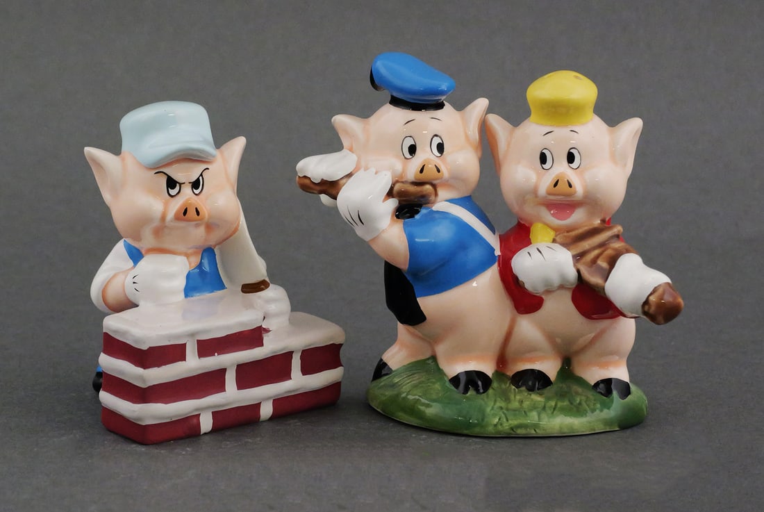 Vintage Disney Three Little Pigs Shakers: 1994 Disney novelty character salt and pepper set. Classic Three Pigs design, original box and packing slip, marked NE Disney, produced by the New England Collector's Society. Approx. 3-1/4"H. This it