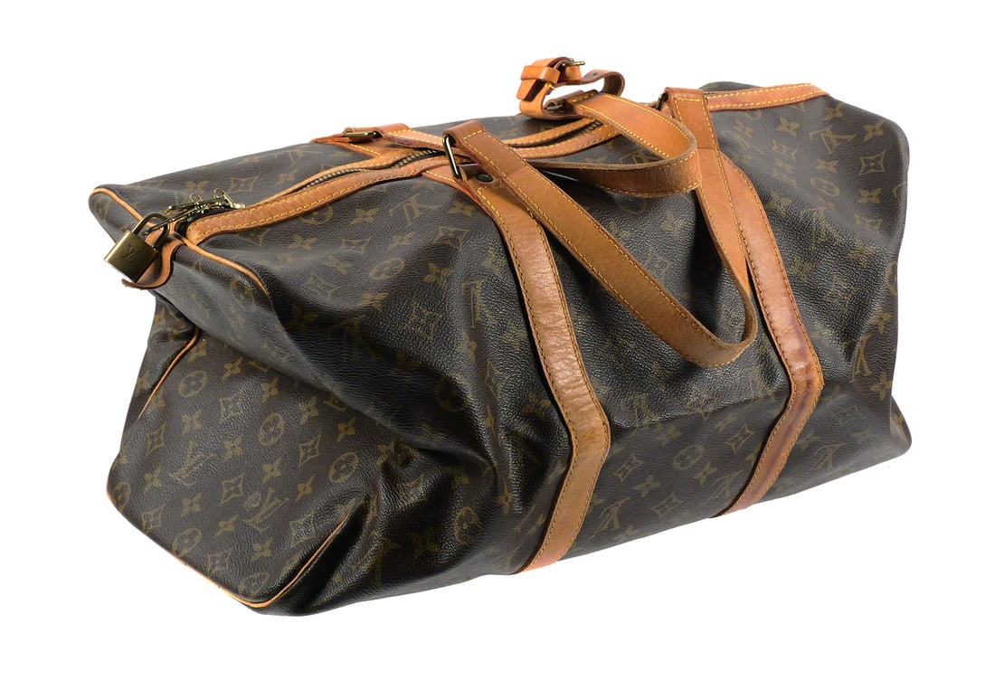 Louis Vuitton Weekender Duffel Bag: Louis Vuitton Weekender duffle bag. Measures approx 18" x 9" x 8". Unconditionally guaranteed to be authentic. This item can be shipped in-house. Multiple lot combined shipping may require 3rd Party