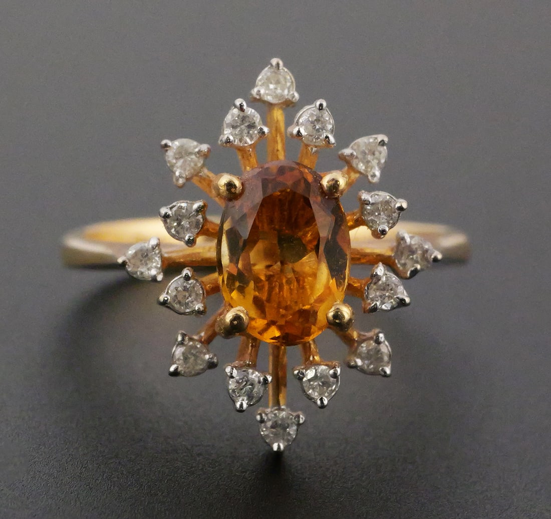 14k Gold Spinel & Diamonds Ring: 14k YG ring with 8mm orange stone, possibly a spinel or citrine, surrounded by 16 diamonds. Size 5. Weighs 3.1 grams. This item can be shipped in-house. Multiple lot combined shipping may require 3rd 