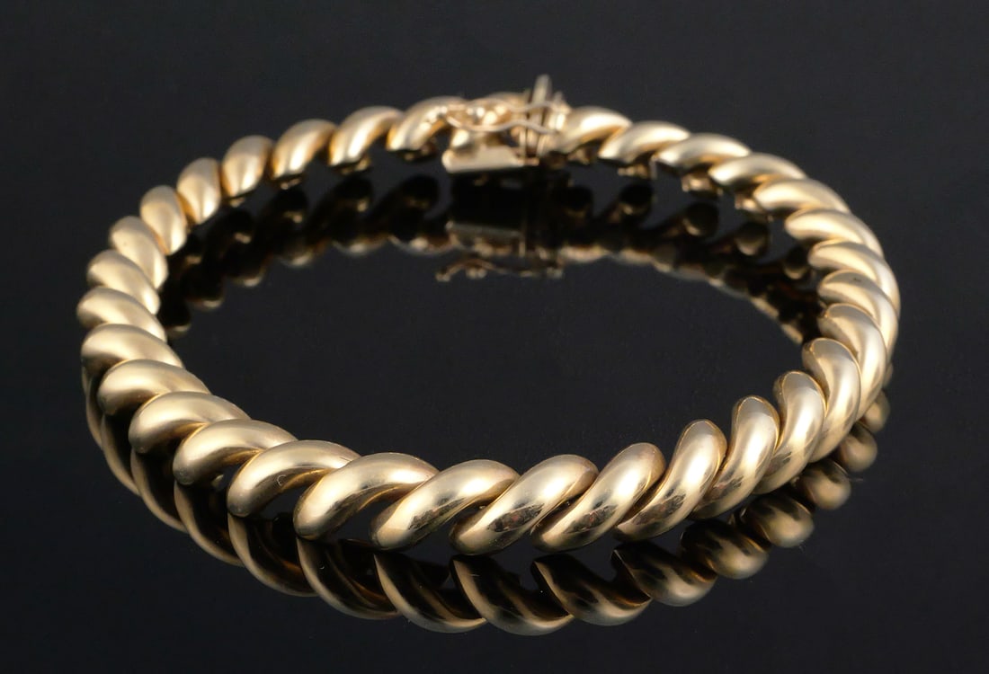 14K Gold San Marco Bracelet: 14 karat yellow gold San Marco link bracelet. Tests as 14 k gold, 19.3 grams tw, 8"L. PLEASE NOTE: Credit cards may not be accepted for this purchase. This item can be shipped in-house. Multiple lot c