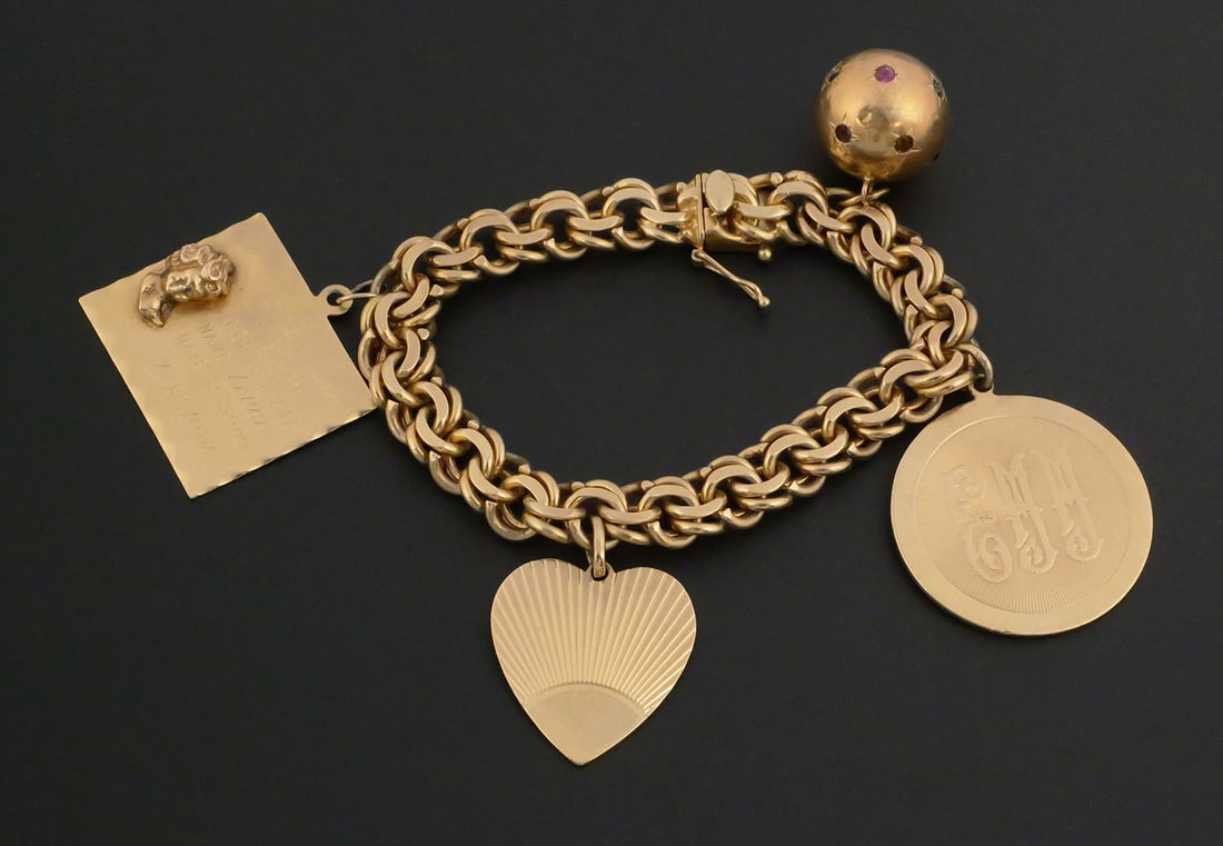 14k Gold Vintage Charm Bracelet: Charm bracelet with four charms, two personalized. All 14k gold. 7" long. Weighs 62.9 grams. PLEASE NOTE: Credit cards may not be accepted for this purchase. This item can be shipped in-house.