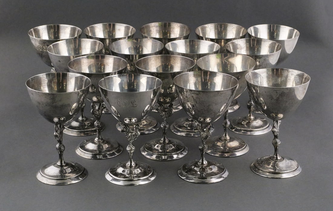 (16) Reed & Barton Sterling Silver Rooster Cups: Reed & Barton X55 American Sterling Silver Goblets with Rooster Stems. Measure 4-3/4" tall x 3" wide. Weight 62.7 Troy oz. Cups are monogrammed with the letters "CDL". This item can be shipped