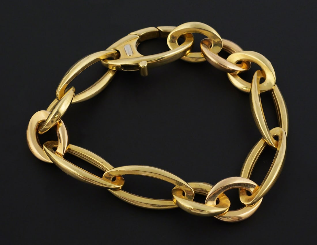 18k Gold Chimento Bracelet: Bold 750 yellow gold bracelet signed Chimento. Measures 9" long. Weighs 23.8 grams. PLEASE NOTE: Credit cards may not be accepted for this purchase. This item can be shipped in-house. Multiple lot