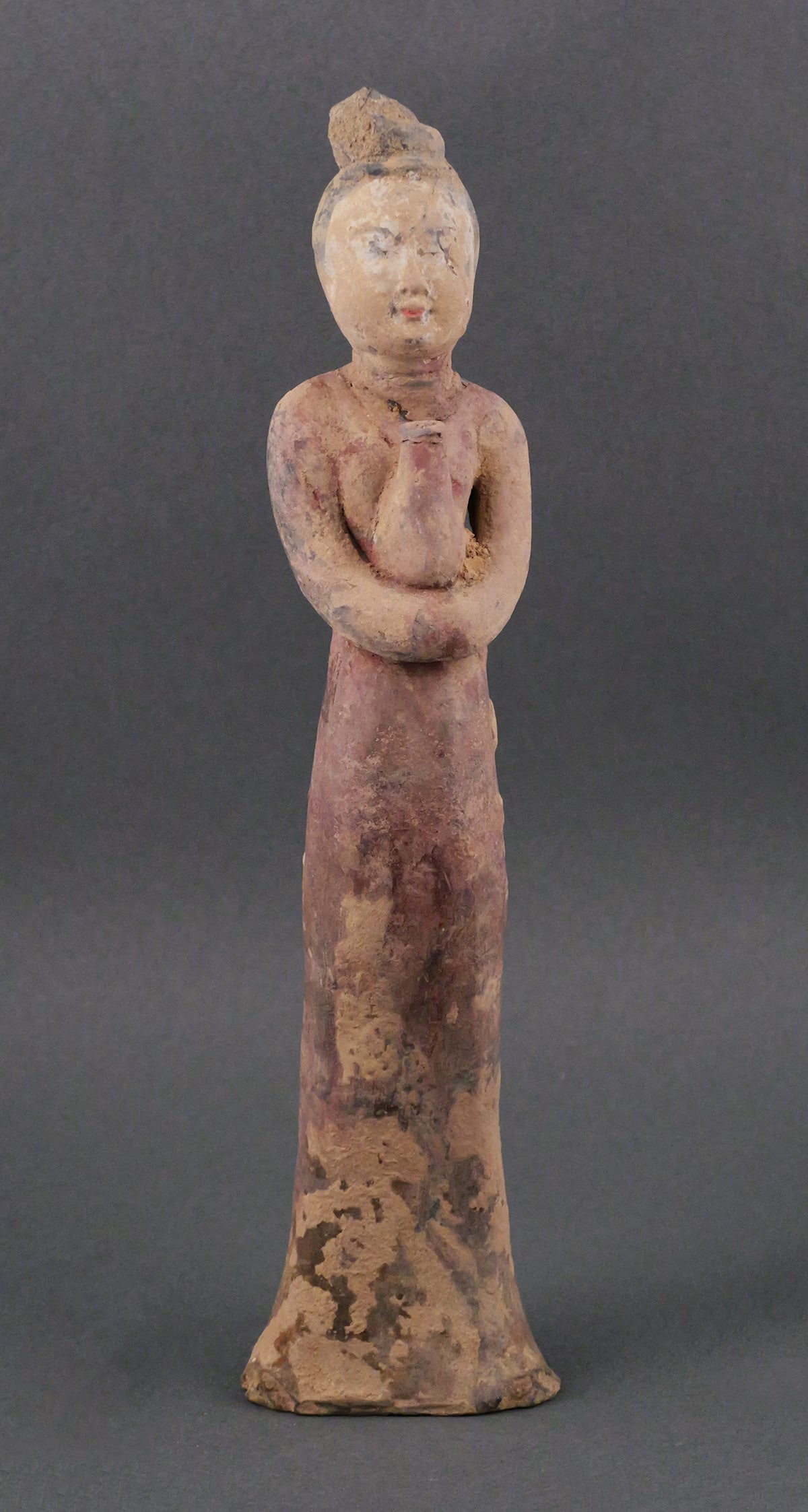 Tang Dynasty Chinese Terracotta Woman Figure: Ancient Chinese terra cotta statue of a woman holding a jar. Circa 7th to 10th century. Measures about 12" high. Unconditionally guaranteed to be authentic and of the period. This item can be shipped