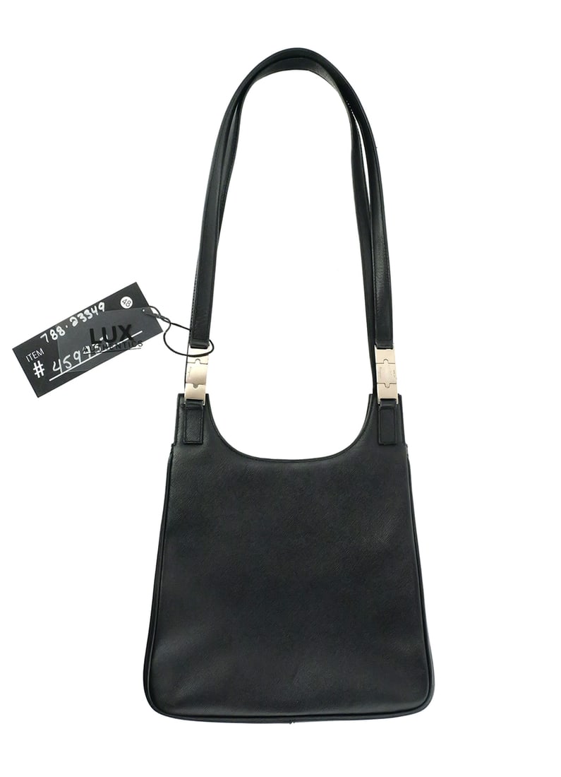 Salvatore Ferragamo Shoulder Bag AF-21 9284: Salvatore Ferragamo Shoulder Bag AF-21 9284. Bag is made of Leather. Color is Black. Measures 9" wide across bottom, 8-1/4" tall bottom to center top, 2-1/2" deep. Straps measure 14-1/2" from center