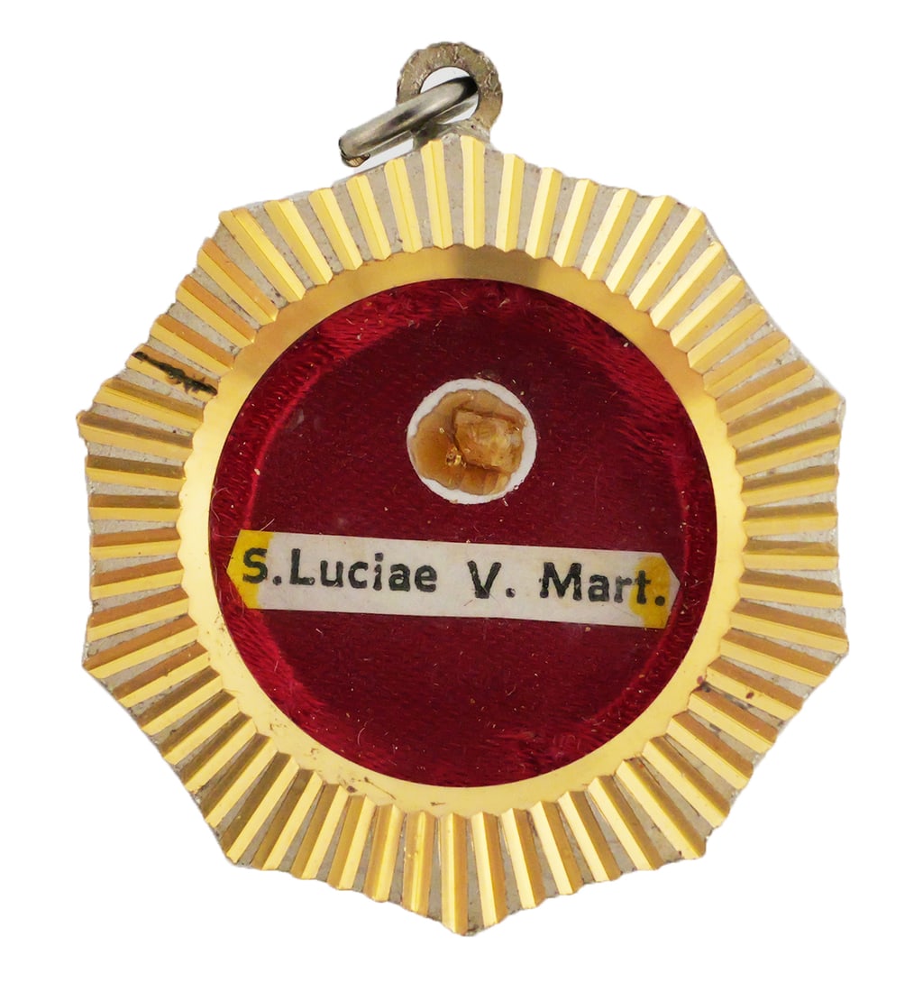 Saint Lucy, Virgin & Martyr Relic: Reliquary "S. Luciae V. M." Sancta Luciae Virginis et Martyris, meaning Saint Lucy, Virgin and Martyr. She is a revered early Christian saint (c. 283-304 AD) celebrated for her vow of purity,