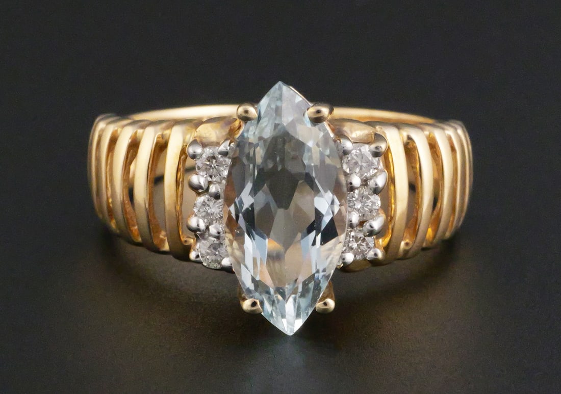 10k Gold Topaz Ring: 10k YG ring with 12mm topaz flanked by six diamonds. Size 6. Weighs 2.8 grams. This item can be shipped in-house. Multiple lot combined shipping may require 3rd Party shipping.