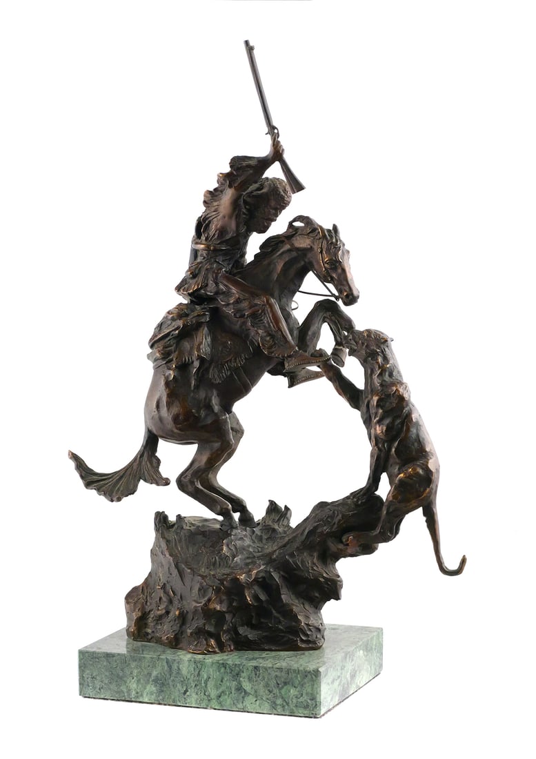 C M Russell, Lion & Trapper, Bronze: C. M. Russell cast bronze western "Lion & The Trapper" sculpture. Measures approx 18" x 11" x 6". This item will need to be shipped by a packing company of your choice. We maintain a list of reliable