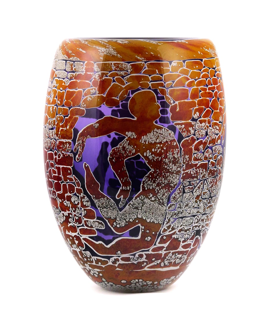 DUNCAN MCCLELLAN Art Glass Vase: Early glass work by artist Duncan McClellan (American, b. 1955), with a brick or stone wall motif framing a male figure. Signed on bottom. Measures about 12-1/2'' high and 9" diameter. This item will 