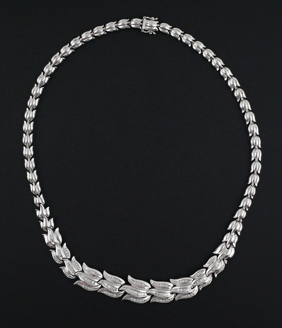 14K White Gold & Diamond Tulip Necklace: 14 karat white gold and diamond necklace. Stylized tulip design collar, encrusted with 1.9 carats of diamonds on the graduated panel links. Marked 585 (14k), 55.4 grams tw., approx 16"L. This item