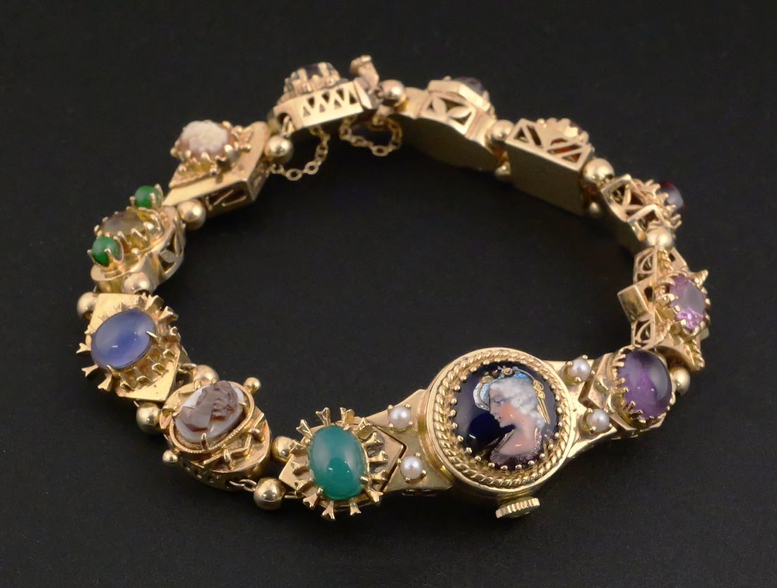 14K Gold Gemstone Bracelet w/ Omega Watch: Vintage Omega ladies manual-wind wristwatch integrated into a 14K yellow gold gemstone bracelet. Overall weight 41 grams. Bracelet measures approximately 6-3/4 inches in length and features a