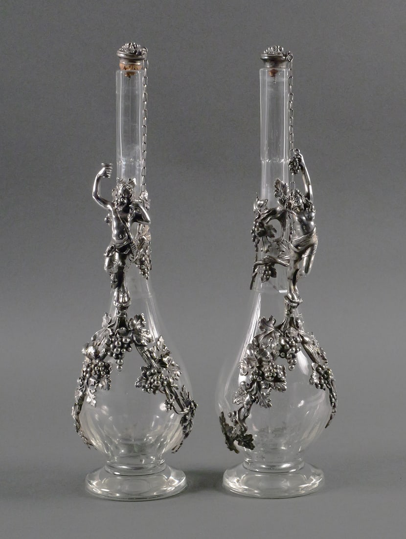 Pr. Antique 800 Silver Wine Decanters: A pair of antique 19th century European 800 silver and faceted glass wine jugs. Ornate Continental silver mounts with figural mythological character handles in the form of a satyr and a semi nude