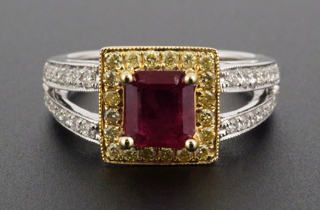 18K White & Yellow Gold Ruby Diamond Ring: 18K two-tone gold ring set with one approximately 1.10 ct non-heated ruby and 20 round white diamonds totaling approximately 0.30 ct with yellow diamonds totaling approximately 0.22 ct. Total