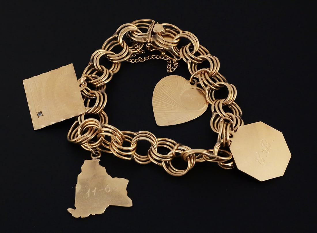 Vintage 14K Gold Bracelet & 4 Charms: 14 karat yellow gold vintage charm bracelet with four charms. Marked or tests as 14 k gold, 32.2 grams tw., approx. 7"L, safety chain does not open. This item can be shipped in-house. Multiple lot