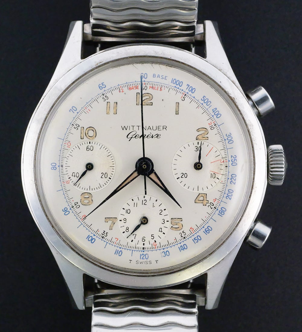 Wittnauer Geneve Chronograph Wristwatch: Wittnauer Geneve manual-wind chronograph wristwatch with a 36 mm stainless steel case and 17-jewel movement. Silver-tone dial with applied Arabic numerals, three-register chronograph layout, blue tach