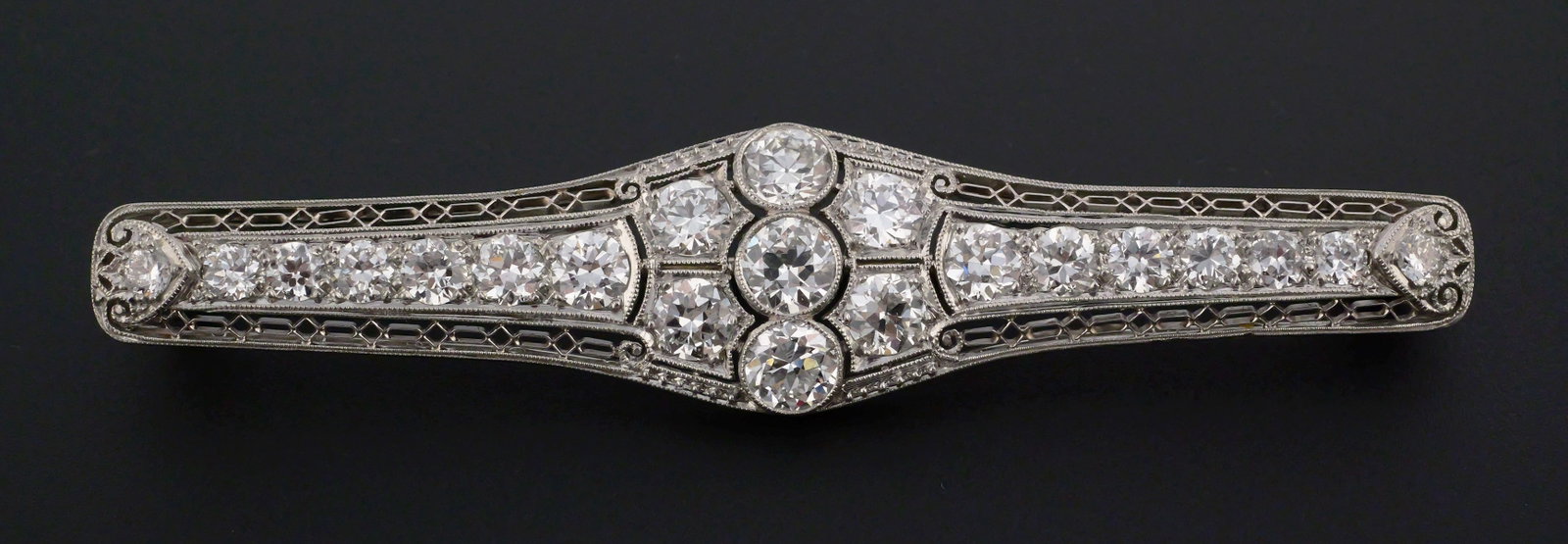 Antique Platinum & Diamond Brooch, 4 Carats: Stunning Edwardian period platinum brooch with 21 old Euro round cut diamonds, 2.5mm to 5.0mm. Four carats total, VS1-VS2 clarity, G-H color. Weighs 9.5 grams. Measures 2-13-16" wide. This item can be