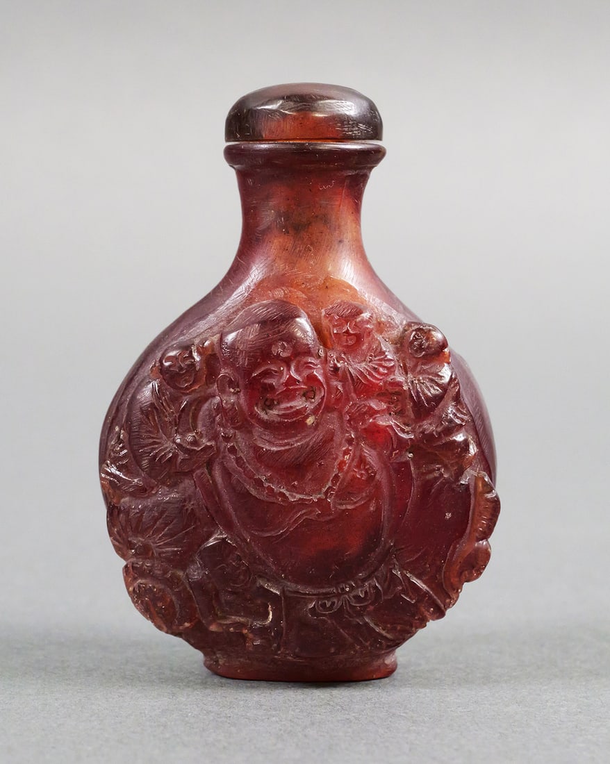 Chinese Amber Glass Snuff Bottle with Stopper: Chinese Amber Glass Snuff Bottle with Stopper. Measures approx 2-5/8" tall x 1-3/4" wide. This item can be shipped in-house. Multiple lot combined shipping may require 3rd Party shipping.