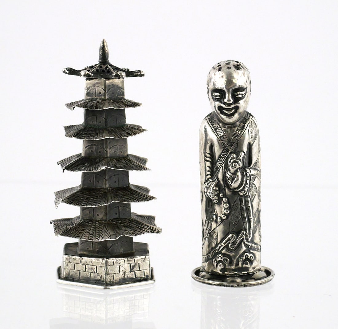 Pair of Chinese Export Silver Figural Shakers: Antique Chinese Export shakers, one in the form of a man, the other a pagoda. Illegible marks on the interior underside of the man. Each approx. 3-3/8"H. This item can be shipped in-house. Multiple