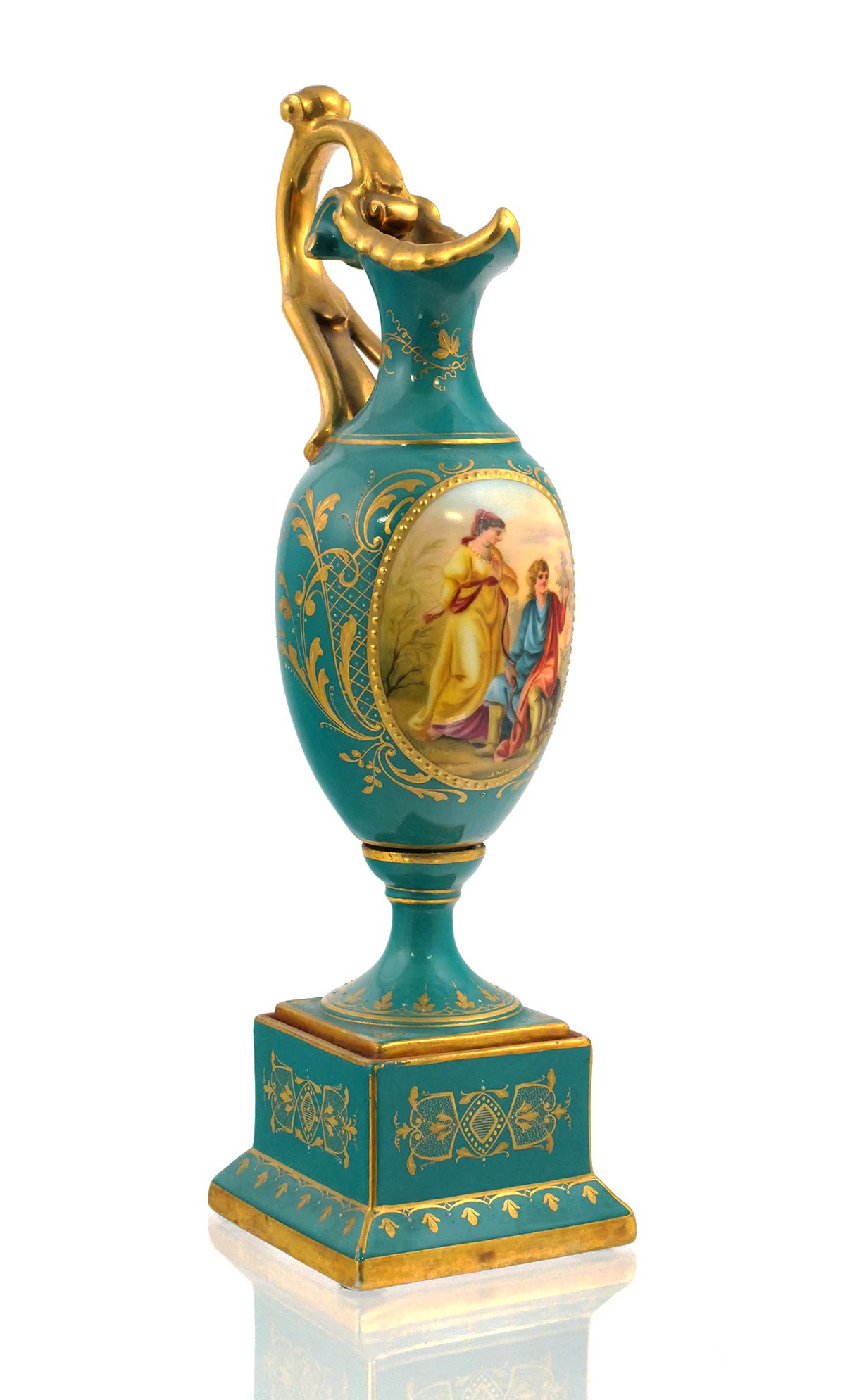 Royal Vienna Hand Painted Porcelain Ewer: Royal Vienna porcelain ewer with figural landscape decorated vignette and scrolled gilt handle with gilt and enameled decoration throughout. All on a teal green ground and squared pedestal base. Royal