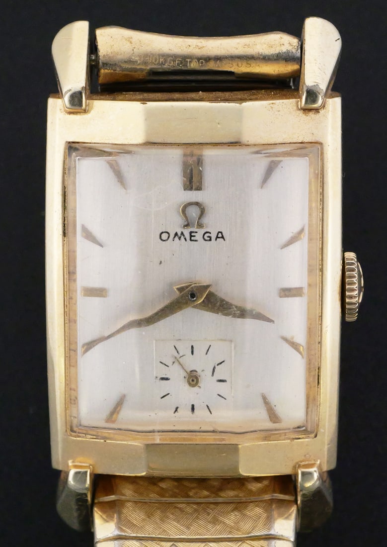 Omega 14K GF Wristwatch 17J Cal. 302: Omega men's manual-wind wrist watch, circa 1952-1953. Features a Swiss Omega caliber 302, 17-jewel movement, serial number 13409128. Rectangular 14K gold-filled Omega case, reference N-6243 / C16482,