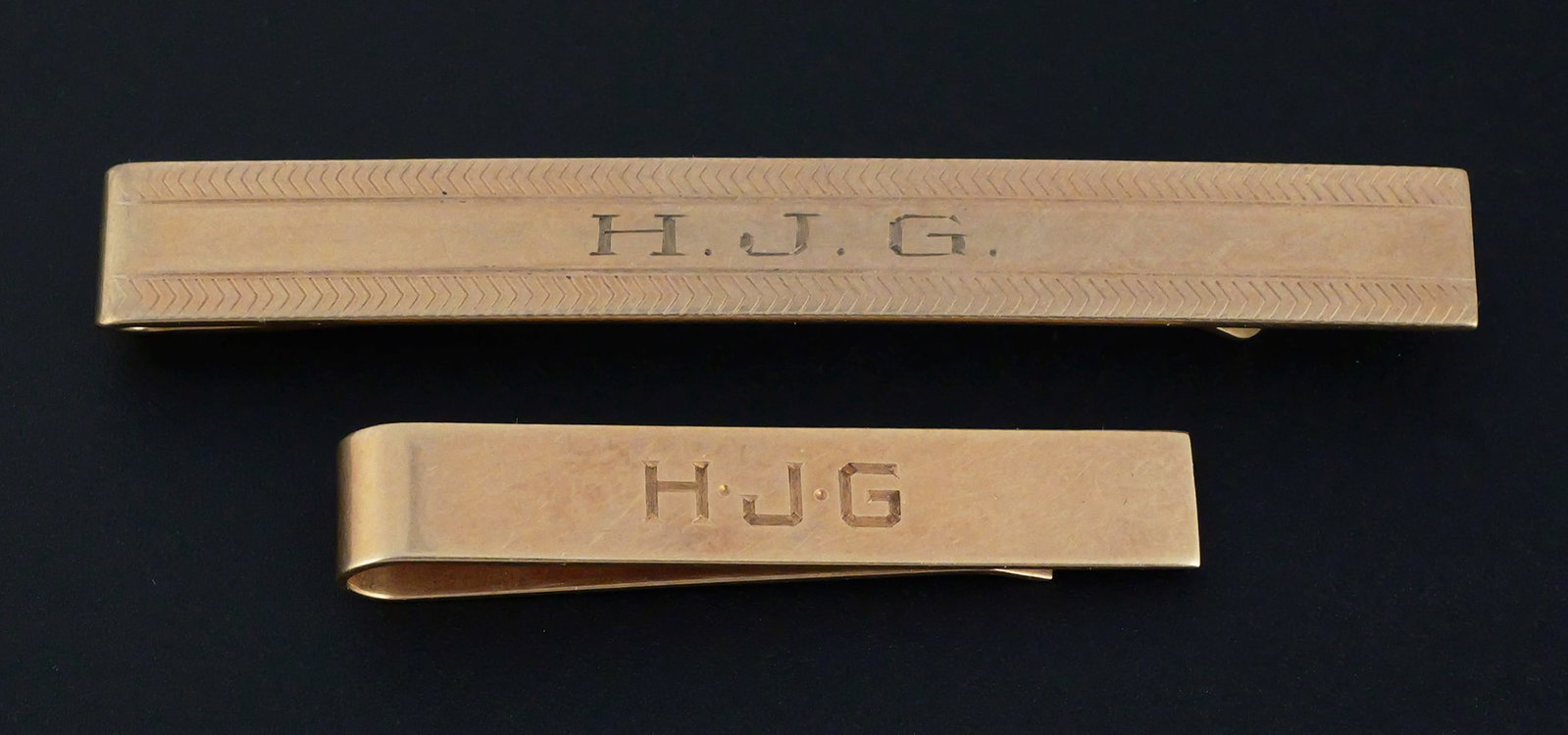 (2) 14K & 10K Tie Bars: Two tie bars. The shorter 14 karat yellow gold, the longer 10 karat yellow gold. 14 k is 3.9 grams tw, 10 k is 6.5 grams tw. Both with monograms. This item can be shipped in-house. Multiple lot
