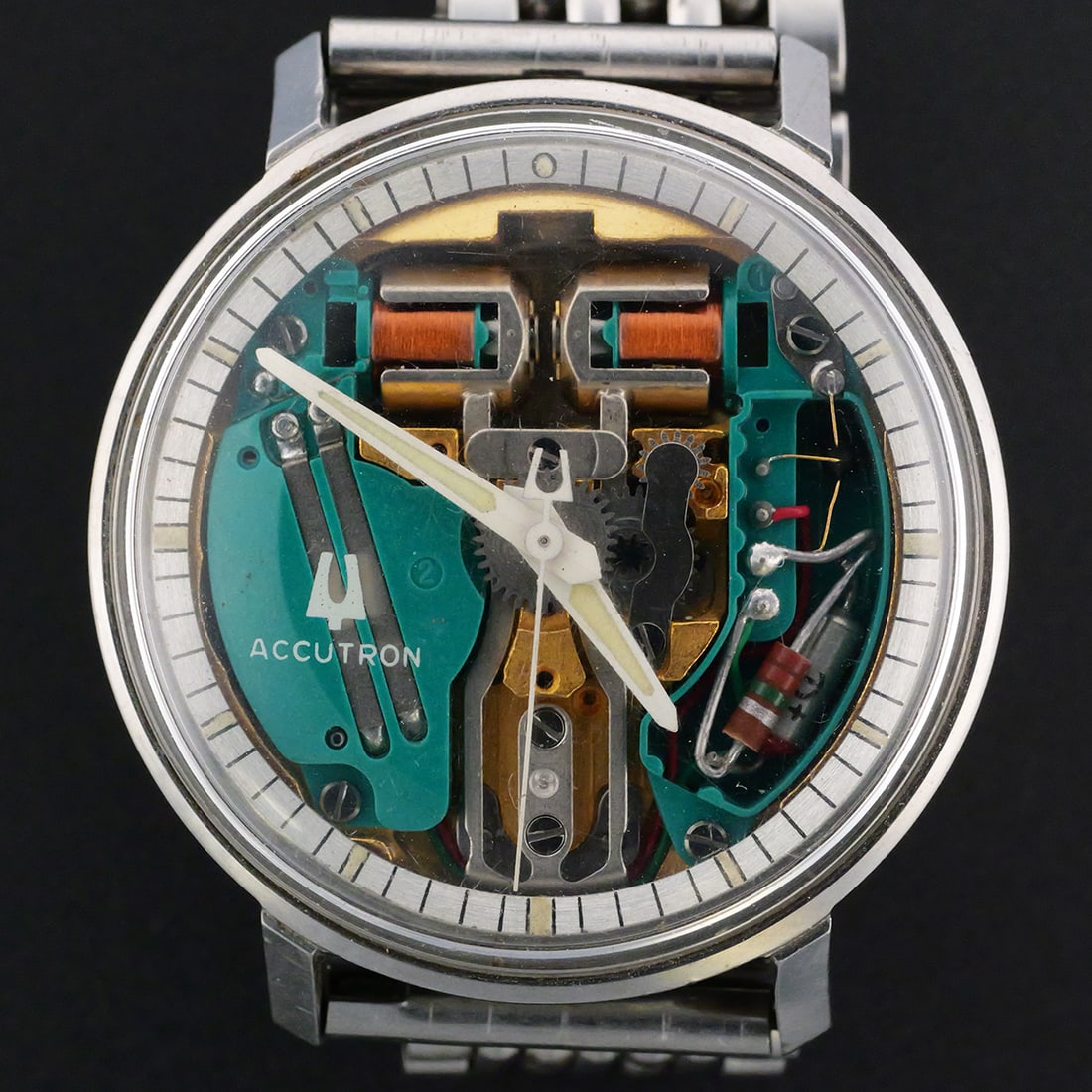 Bulova Accutron Spaceview Watch: Bulova Accutron Spaceview tuning fork wristwatch with a 34.5 mm round case, transparent dial displaying the electronic movement and original Bulova bracelet. Case back marked "Bulova," "Patented,"