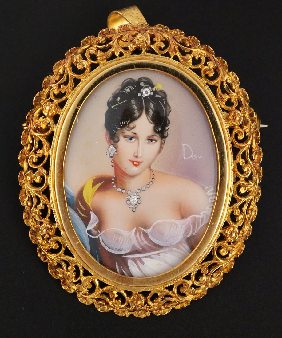 18K Gold & Diamond Portrait Brooch Pendant: 18 karat yellow gold pin/pendant with signed portrait accented with diamonds. Unknown subject, Josephine inspired, set in a floral filigree oval frame with a pin back and bail. Marked as 18 k gold,