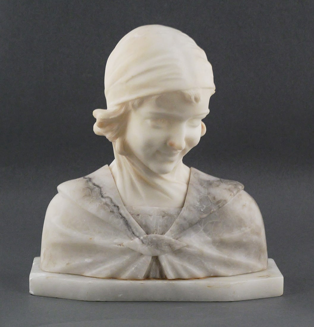 Antique Victorian Carved Marble Bust of a Girl: Antique Victorian Carved Incised Marble or Alabaster Figural Bust of a Girl. Carved in stone lower back is marked "Made in Italy" and "27/054". Measures approx 10" wide x 10-1/2" tall x 4-1/" deep.