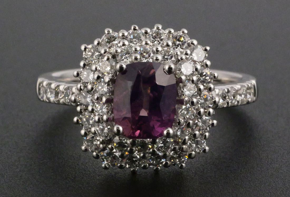 Platinum Kashmir Sapphire & Diamond Ring: Platinum ring set with one cushion-cut natural purple-pink Kashmir sapphire weighing approximately 1.24 carats and 40 round brilliant-cut natural diamonds totaling approximately 0.87 carats. Diamonds