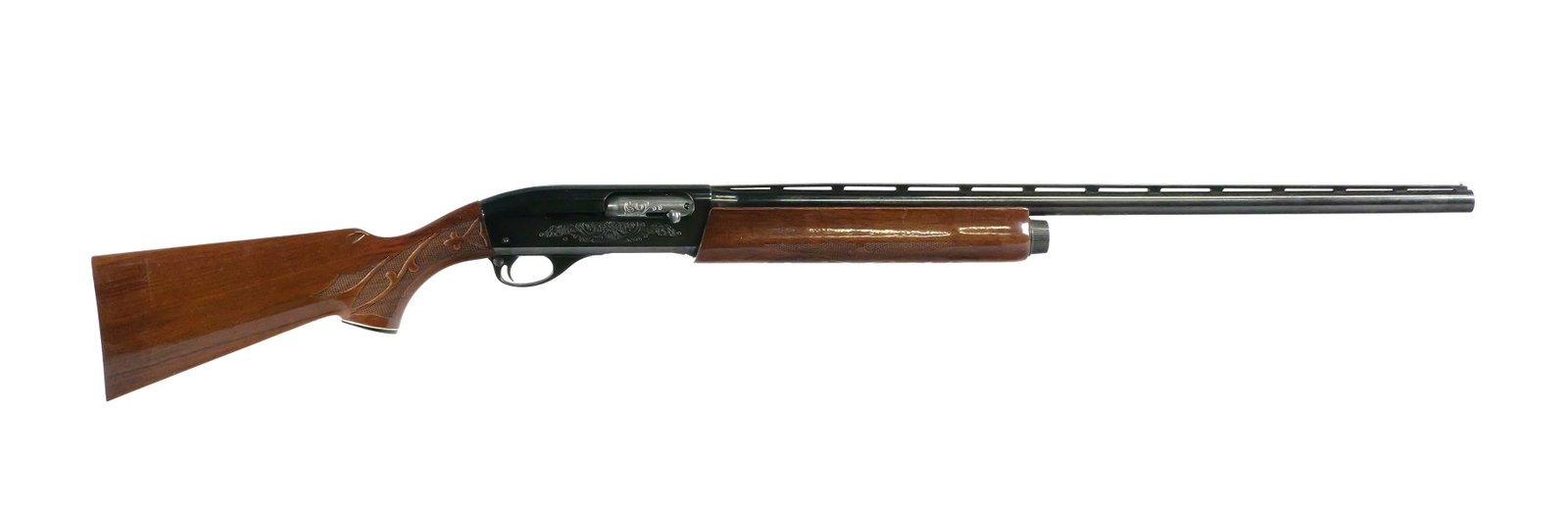 Remington Model 1100 12 Ga Shotgun: Remington Model 1100 semi-automatic 12 gauge shotgun chambered for 2-3/4" shells. Serial number N125605V, (circa 1978-1984). Features an engraved receiver, 28" vent rib barrel marked MOD and measures