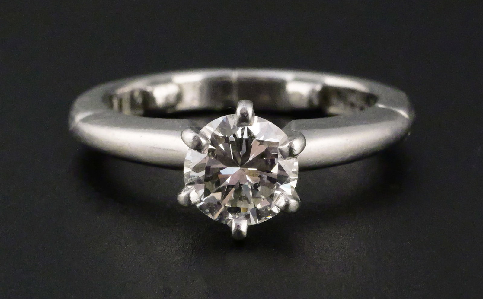 Platinum and Diamond Ring, poss Tiffany: Platinum and 6mm Round Diamond Ring. Exceptionally clean VS diamond, about 6.1mm (just under 1 carat), color F-G. Ring is marked "FM PLT 950" and "Dec. 22 1961 C.W. H.M.C." Weight is approx 5.7 grams 
