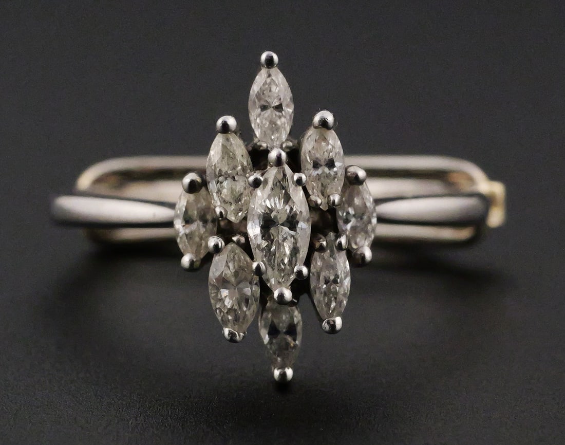 Platinum and Diamonds Tiffany & Co Ring: Platinum ring with nine diamonds, signed Tiffany & Co. Weight approx 5.0 grams with stones. Diamond weight about 0.64 carats. Accompanied by original 1981 purchase order from Tiffany & Co. Size 7.5