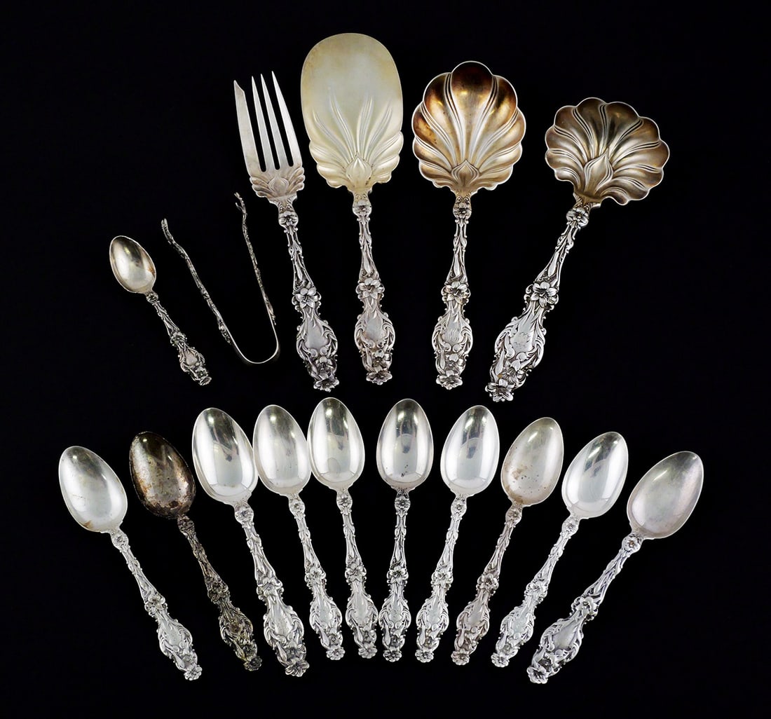(16) Whiting 1902 Lily Sterling Silver Flatware: 16 pieces of Whiting's iconic Art Nouveau "Lily" pattern from 1902. Some serving pieces, as shown. Some pieces monogrammed. Total weight about 21 Troy ounces. This item can be shipped in-house. Multip
