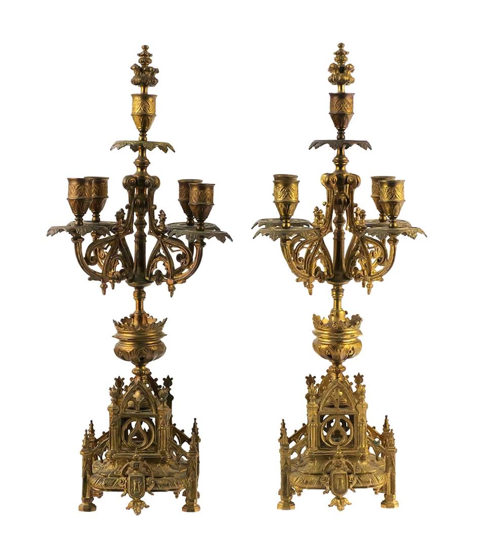 Pair Gothic Revival Gilt-Metal Candelabra: Pair of large gilt-metal Gothic Revival five-light candelabra, each with an elaborate architectural base incorporating pointed arches, quatrefoil tracery, crockets, finials and heraldic shield