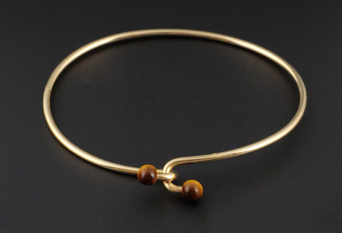 14K Gold Tiffany Tiger Eye Bracelet: 14K Gold Tiffany Bracelet. Weight is approx 7.8 grams with stones. This item can be shipped in-house. Multiple lot combined shipping may require 3rd Party shipping.