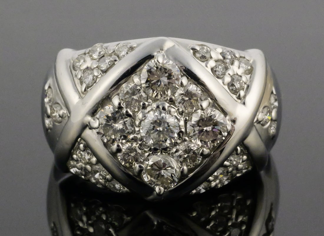 Platinum & 1.0 ct Diamonds Ring: Stunning modern platinum ring with 1.0 cttw diamonds. Size 6-1/4. Weighs 7.3 grams. This item can be shipped in-house. Multiple lot combined shipping may require 3rd Party shipping.