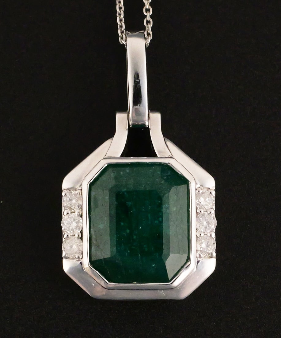5.77 ct Emerald Diamond Platinum Pendant: Oscar Friedman platinum pendant set with a 5.77 ct. octagonal step-cut natural emerald and six round brilliant-cut natural diamonds totaling 0.25 ct., H-I color, SI2-I1 clarity. 18" platinum chain.