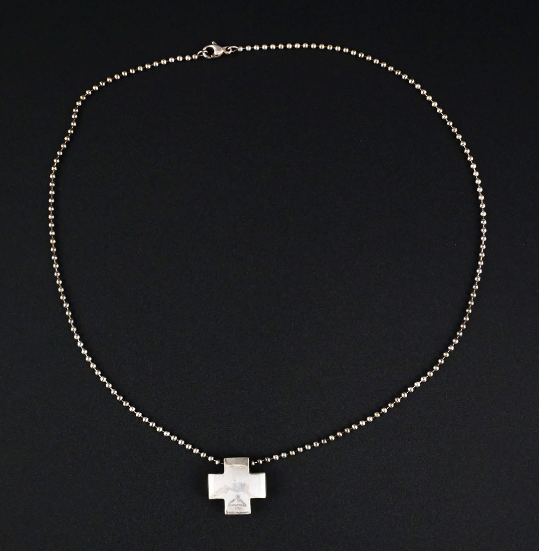 Tiffany Sterling Silver Square Cross Necklace: Tiffany & Co. sterling silver cross pendant on a 16" sterling silver ball chain with lobster clasp. Pendant marked "TIFFANY & CO. 925"; clasp marked "925." Gross weight 12.5 grams. This item can be